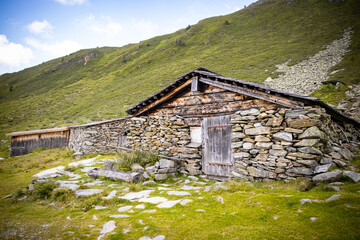 stone country cottage with wooden door no trees