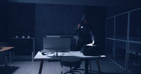 Thief Stealing Computer From Office