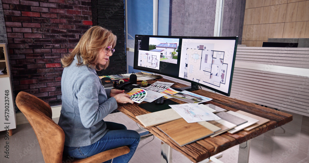 Aufkleber side view of real estate designer working on computer