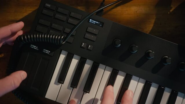 MIDI synth piano keyboard on a vintage wood table