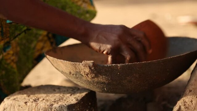 Close Up View Of Woman Cooking In Africa