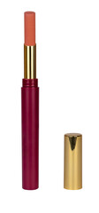 Lipstick of a nude look in a red and golden package and with a lid beside it