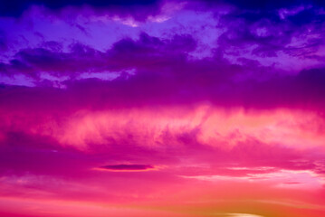 Surreal background of violet, purple, pink, yellow clouds in the sky, background, texture, close up.

