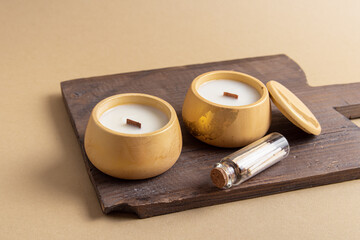 Two interior candles and matches. Scented candles on wooden board