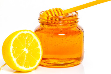 Jar with honey on white background