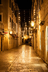 Empty Dubrovnik city streets during winter, decorated withchristmas lamps