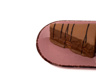 Piece of chocolate cake isolated on white background. A slice of chocolate cake.
