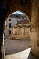 Entry to the most famous Dubrovnik city promenade, Stradun  street with Big Onofrio's fountain in the foreground