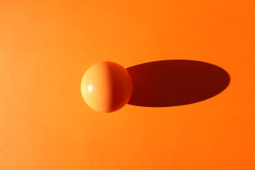 Orange ball on orange background
