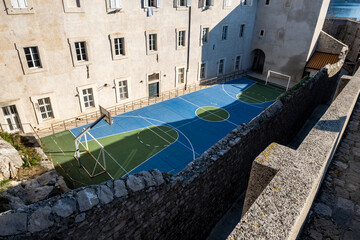 Basketball playground of old school on the medieval walls in old part of Dubrovnik city, Croatia