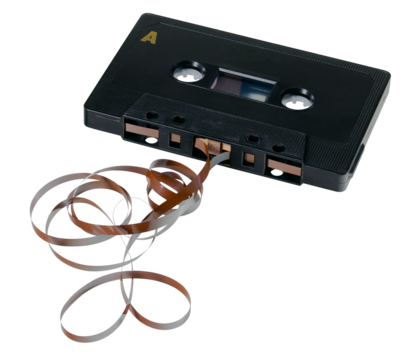 Cassette tape with tape pulled out, isolated background.