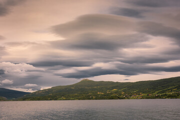 Majestic lenticular cloud over a fjord, in Norway