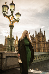 London woman on Westminster Bridge by Big Ben, England. Beautiful tourist girl sightseeing travel...