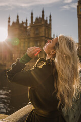 London woman on Westminster Bridge by Big Ben, England. Beautiful tourist girl sightseeing travel...