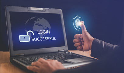 Fingerprint scan with digital safety shield icon on virtual screen while thumb scanning for computer network security access, Surveillance and security scanning of cyber futuristic applications.