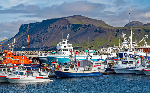 Bolungarv&iacute;k, Iceland - June 9. 2008: Beautiful icelandic ocean harbor ,fishing ships, high mountains