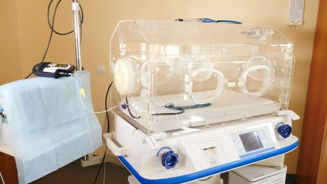 Neonatal intensive care advanced equipment. Monitoring equipment of premature infant. Tubes and wires from apparatuses in postpartum. Equipped medical room. 4 k video