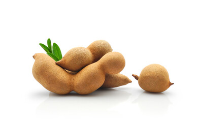 Sweet tamarind fruits with green leaf close-up isolated on white background      