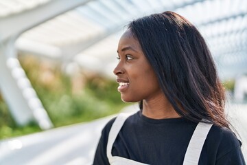 Young african american woman smiling confident standing at park