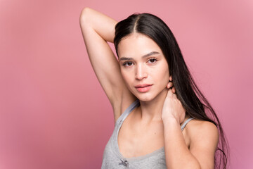 Fototapeta premium Young woman with long hair in studio