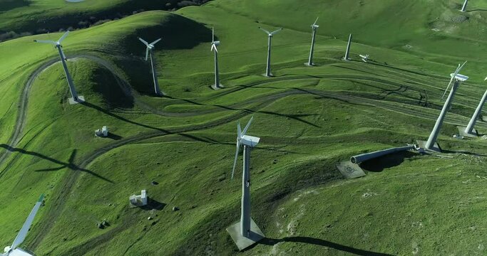 Altamont Wind Farm aerial footage, pulling back above wind turbines, California windmill aerial