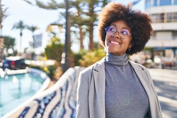 African american woman executive smiling confident standing at street