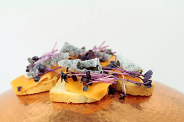 fish free smoked lax on rusk with cress and seaweed chips