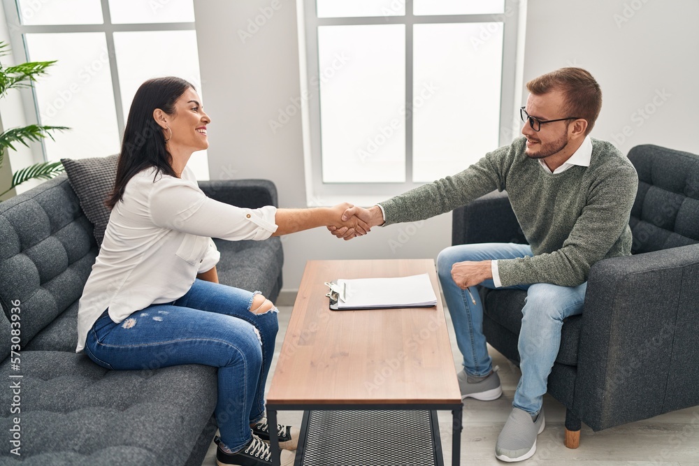 Canvas Prints Man and woman psychology and patient having psychologist session shake hands at psychology clinic