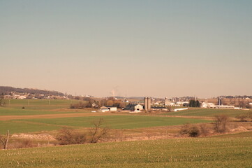 Valley of Small Farms in Winter with Blue Sky