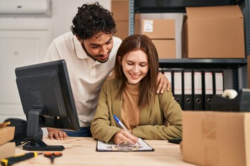 Man and woman business workers working at office