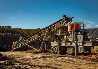 Fototapeta na wymiar Conveyor Belt for rock crushing at a construction site