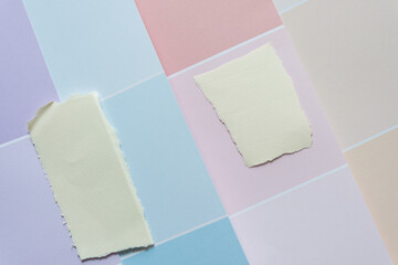 torn paper pieces on paper pad sheets with paint-chip design