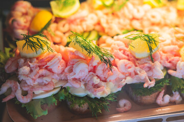 Swedish sandwich with shrimp and egg, traditional finnish style seafood snack, bread with boiled shrimps prawns and eggs, dill, lemon and mayonnaise, scandinavian breakfast