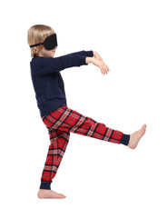 Boy in pajamas and sleep mask sleepwalking on white background