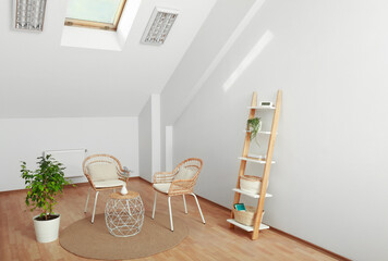 Attic room with stylish wooden furniture. Interior design