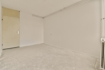 an empty room with white walls and no one door on the other wall in this photo is taken from inside