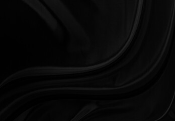 Black gray satin dark fabric texture luxurious shiny that is abstract silk cloth background with patterns soft waves blur beautiful.