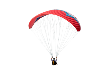 The sportsman flying on a paraglider. isolated on transparent background with clipping path. Beautiful paraglider in flight  with clipping path and alpha channel. for both printing and web pages. 
