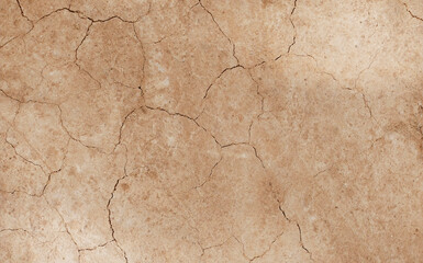 Fototapeta premium Cracked ground background in the top view for graphic design or wallpaper