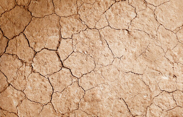 Cracked ground background in the top view for graphic design or wallpaper
