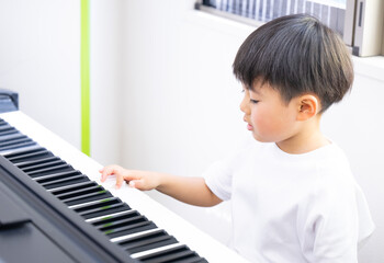 Child playing piano Boys
