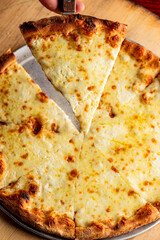 Pizza. Cheese Pizza. Traditional New York City style margarita pizza pie with a thin homemade crispy crust, tomato, garlic, marinara sauce topped with buffalo mozzarella cheese and fresh basil leaves.