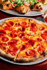 Pizza. Cheese Pizza. Traditional New York City style margarita pizza pie with a thin homemade crispy crust, tomato, garlic, marinara sauce topped with buffalo mozzarella cheese and fresh basil leaves.