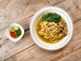 Noodle chicken soup (mie ayam) Indonesia food served on bowl.