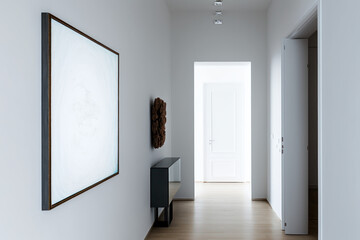 White empty art frame in modern hallway