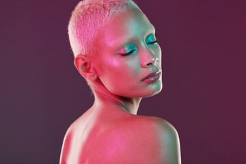 Skincare, cosmetics and woman with neon makeup and lights for creative advertising on studio...