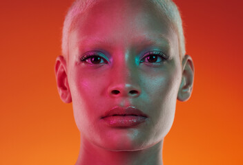 Face, neon beauty and portrait of woman with makeup and light in creative advertising on orange background. Art, fantasy girl and model isolated in skincare and futuristic mockup space in studio