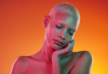 Skincare, beauty and neon cosmetics, woman with face makeup and light in creative advertising on orange background. Cyberpunk, product placement and model isolated in future mockup space in studio.