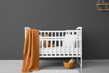 Obraz na płótnie Canvas White crib in modern children's room interior