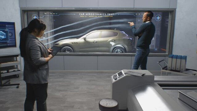 Engineers check aerodynamics of eco-friendly electric car in lab for modern modifications using wind tunnel with steam. Computer system for changing parameters. Car testing and technologies concept.